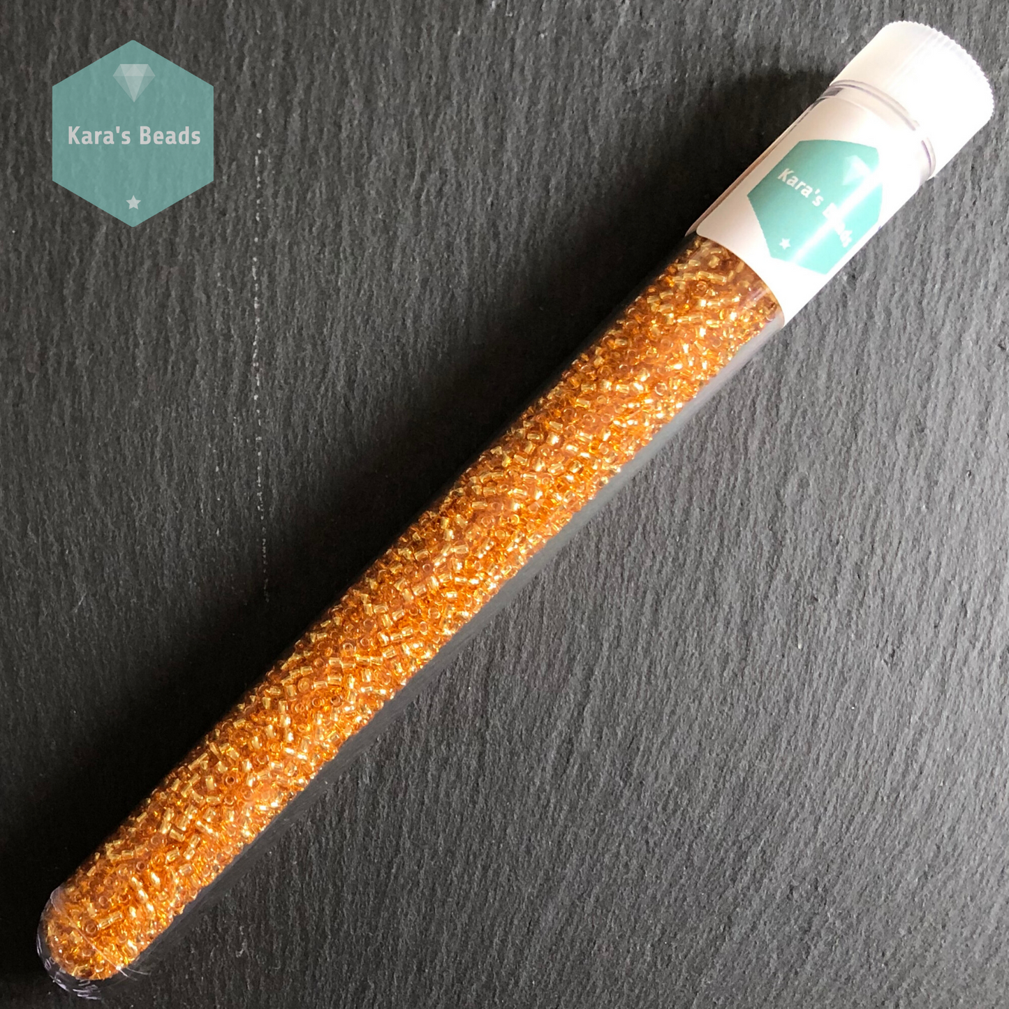 25g Tube 11/0 Toho TR11-22B Silver Lined Medium Topaz