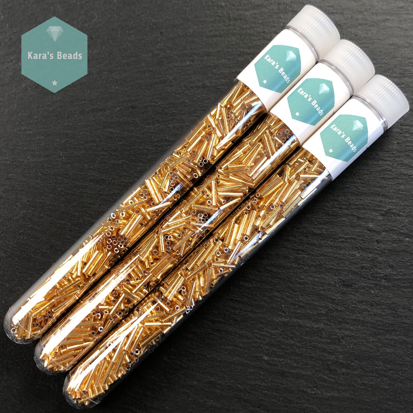 18g Tube 9mm Toho Bugles TB3-22B Silver Lined Medium Topaz