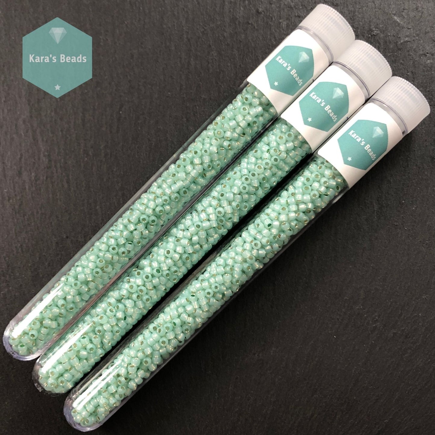 25g Tube 8/0 Toho TR8-2118 Silver Lined Milky Light Peridot