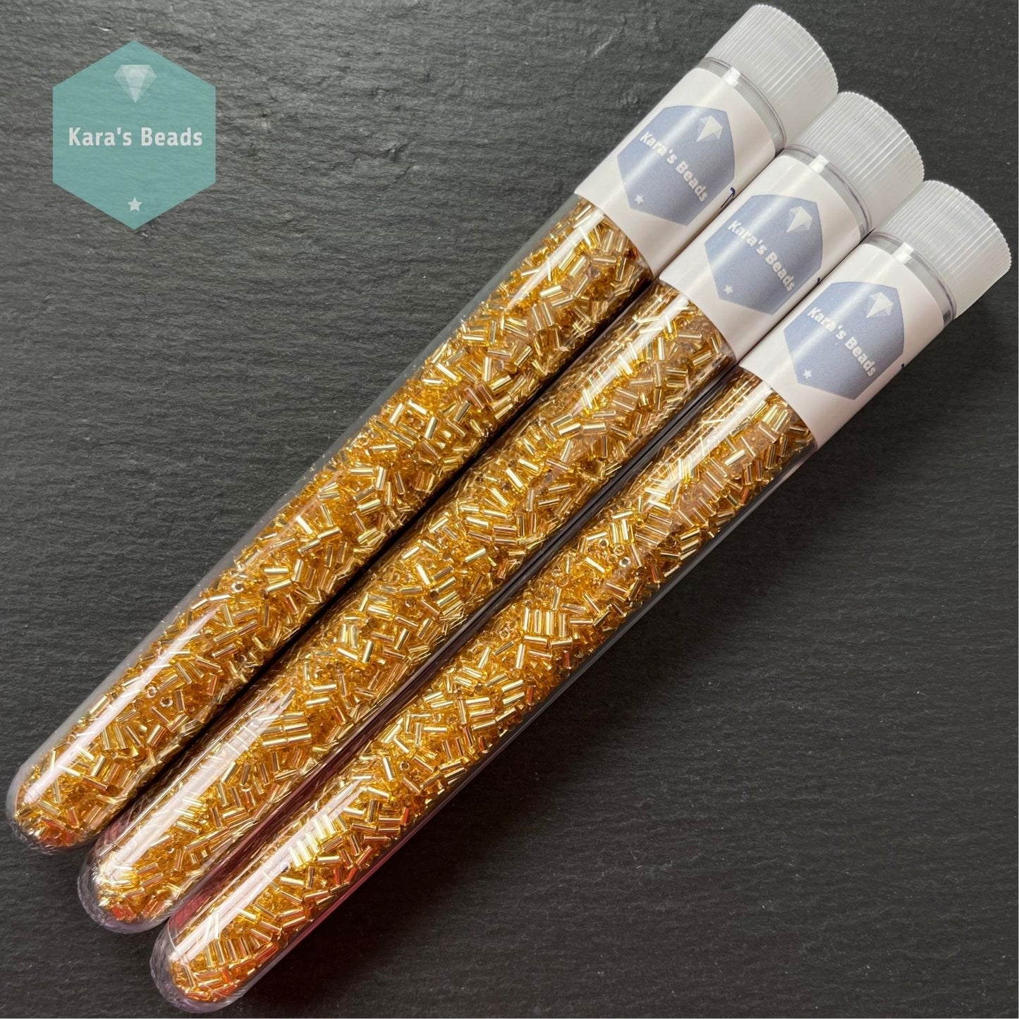 22g Tube 3mm Toho Bugles TB1-22 Silver Lined Light Topaz